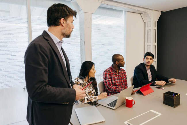 focused_203719244-stock-photo-office-team-meeting-room